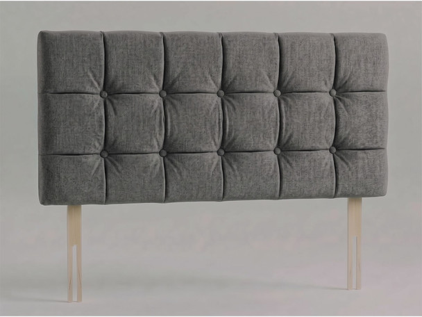 Tessera bed headboard in Steel Grey Atlanta fabric with a grid of padded squares, matching fabric buttons and wooden fixing struts