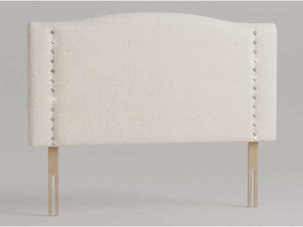 Celeste diamante studded headboard in White Ivory Atlanta fabric with contemporary arched top and vertical crystal tufting