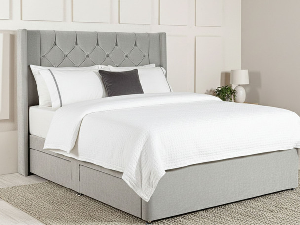 Upgrade your bedroom with the Holbrook Floor Standing Headboard. Its elegant wing design and customizable options make it a stylish and stable choice for any decor.