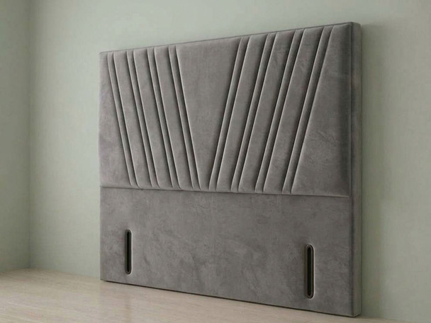 ​A sophisticated, tufted headboard upholstered in deep grey velvet, bringing a touch of plush luxury to a modern bedroom setting.