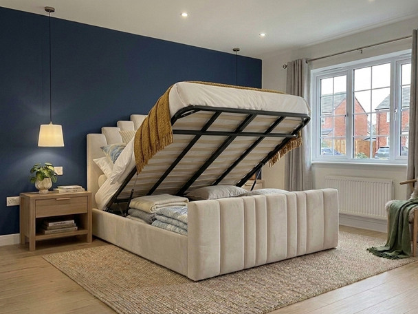 ​"A cream velvet ottoman bed lifted open via a gas-strut mechanism, revealing a spacious, solid-base hidden storage compartment inside the triple-reinforced frame."