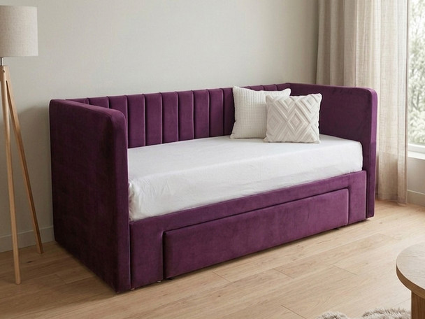 This image features a handcrafted Basil Day Bed upholstered in smooth amethyst velvet, showcasing a luxury sofa-style backrest with vertical fluted details and plain padded arms.