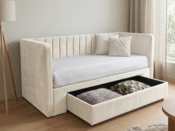 This image displays a pale cream velvet Basil Day Bed with its heavy-duty jumbo storage drawer pulled open, demonstrating the maximum under-bed storage space available for bedding and clutter.
