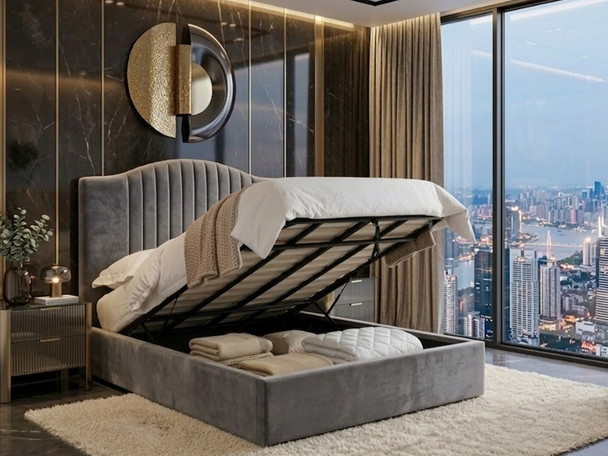 Grey fabric ottoman storage bed in an open position revealing deep underbed storage and a heavy-duty gas-lift mechanism.