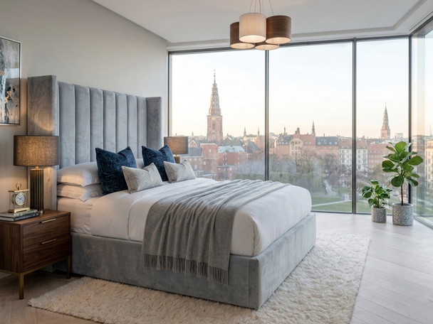 Adele Ottoman Storage Bed Frame upholstered in plush grey velvet, featuring a handcrafted wing headboard with deep vertical fluted accent panels.