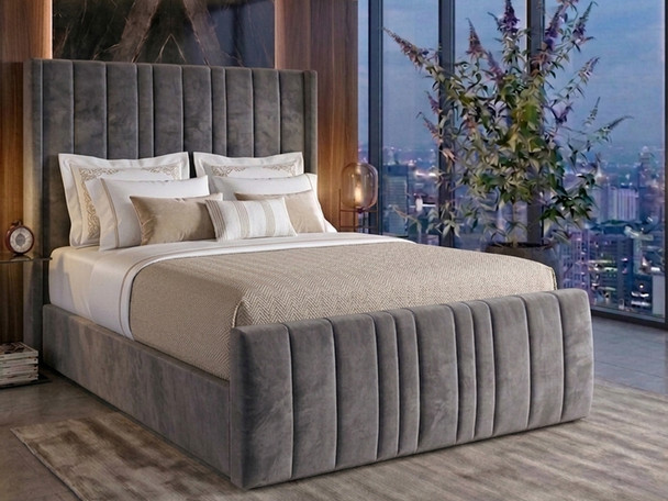 Carla Ottoman Storage Bed Frame featuring deep vertical fluting in smooth grey velvet