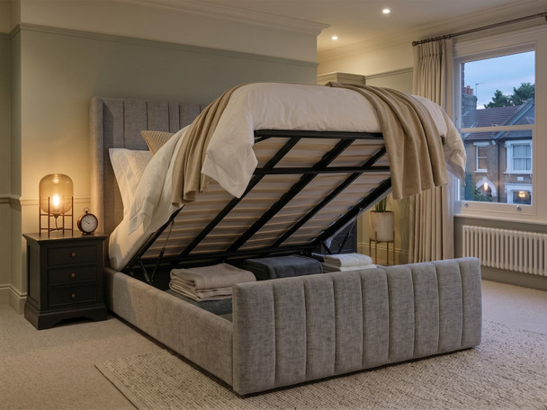 Carla Wingback Ottoman Storage Bed Frame in Steel Grey Atlanta fabric, shown lifted open to reveal the spacious under-bed storage area.