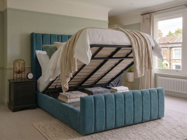 Carla Wingback Ottoman bed in Teal Atlanta fabric, shown with the mattress lifted to reveal the spacious under-bed storage area.