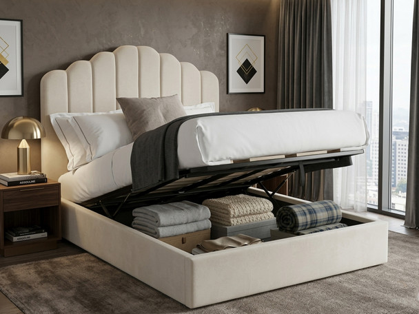 Cream velvet Elsa Ottoman Storage Bed shown open, revealing the spacious under-bed storage compartment, gas-lift mechanism, and solid base boards