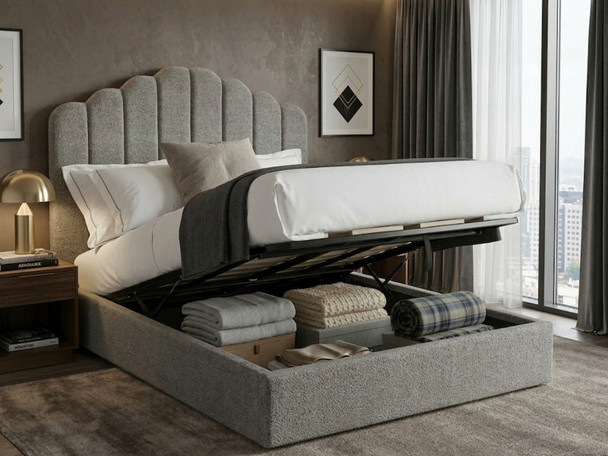Grey bouclé Elsa Ottoman Storage Bed with the heavy-duty gas-lift frame raised, displaying the maximum capacity internal storage solution