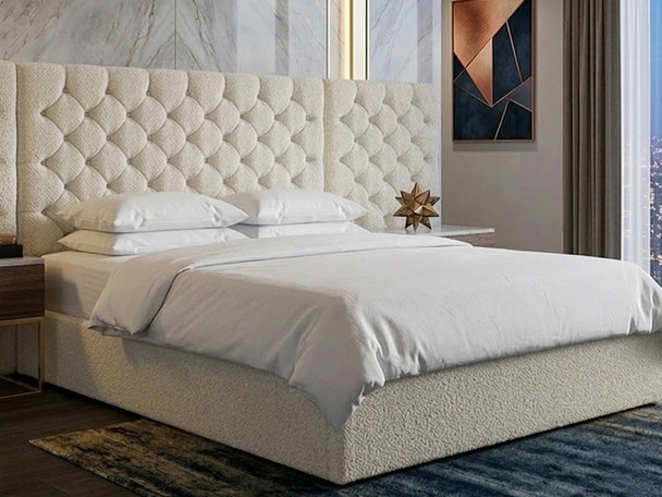 Beige velvet double ottoman bed frame showing the elegant wide headboard and low footboard design