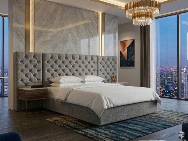 Grey fabric ottoman bed frame with a wide upholstered headboard, a bestselling luxury storage bed