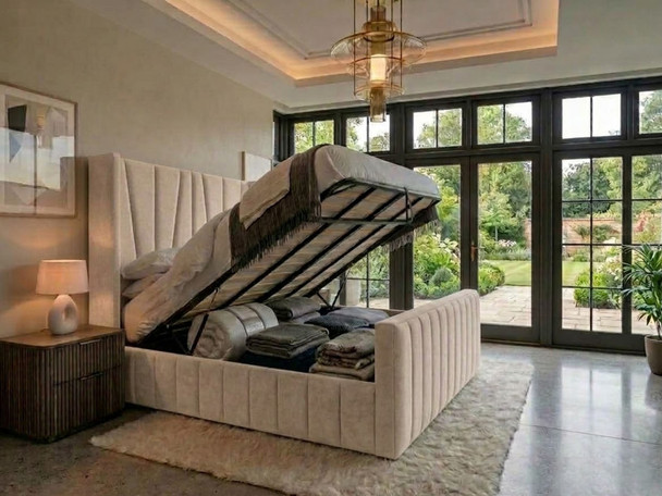Oatmeal Velvet Chelo wingback ottoman storage bed lifted open, showing the solid storage base and slatted platform