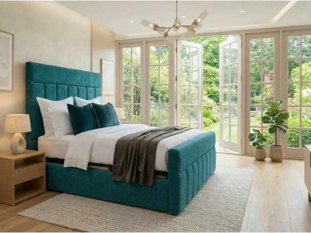Maricela ottoman storage bed in teal bouclé with a tall headboard, vertical channels and a matching channelled footboard, handmade in Birmingham