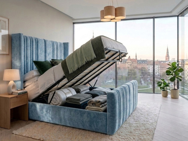 Luisina ottoman storage bed in sky blue velvet with the gas-lift base raised, revealing the spacious under-bed storage area