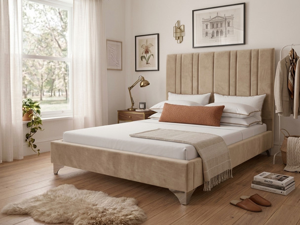 Mirta upholstered bed frame in warm beige velvet, displaying the tailored vertical accent lines on the headboard and a low-profile footboard.