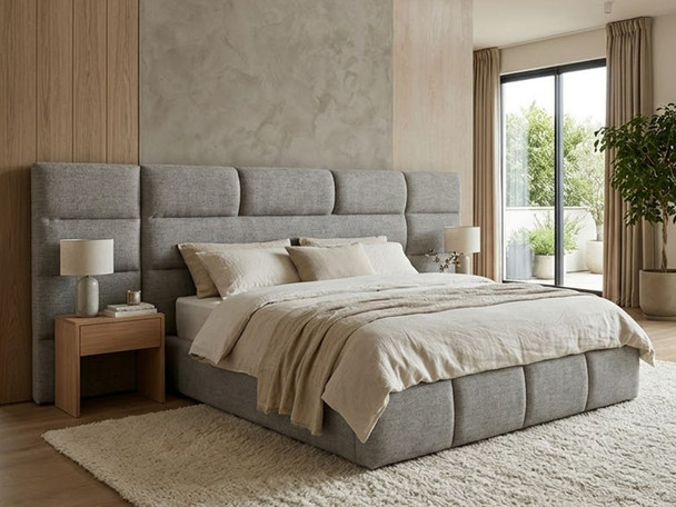 ​A modern handcrafted bed finished in Grey Tweed wool-textured fabric, styled in a sleek, contemporary penthouse bedroom with luxury furnishings.