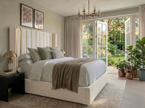 Oksana wingback ottoman bed in ivory boucle with deep fluted headboard and gold accents