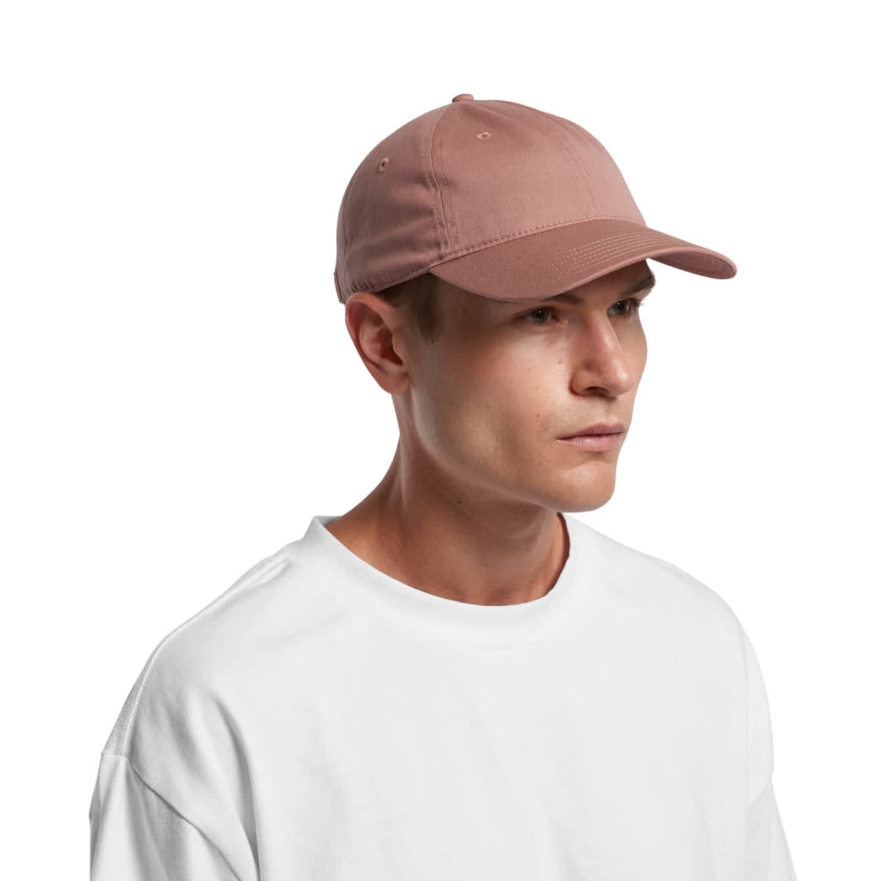 A cap in a soft pink colour, featuring a curved visor and a rear adjustment strap. It has a logo on the side.