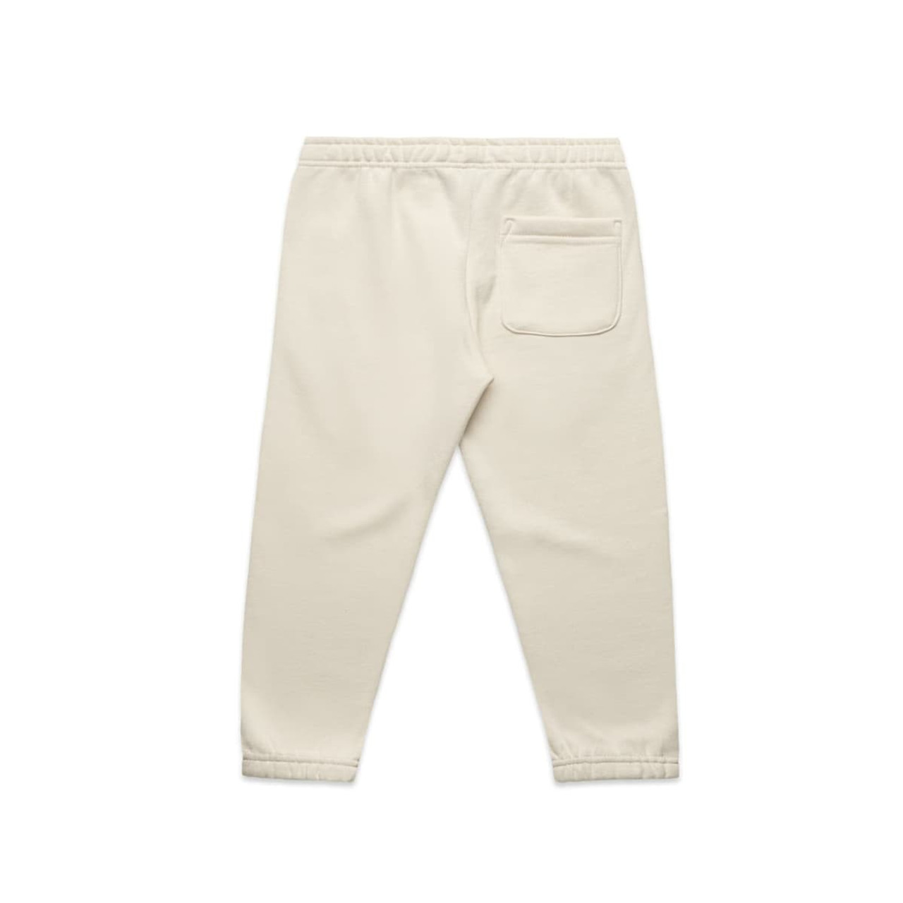 Cream-coloured kids' track pants featuring an elastic waistband and a single back pocket. Includes a logo.