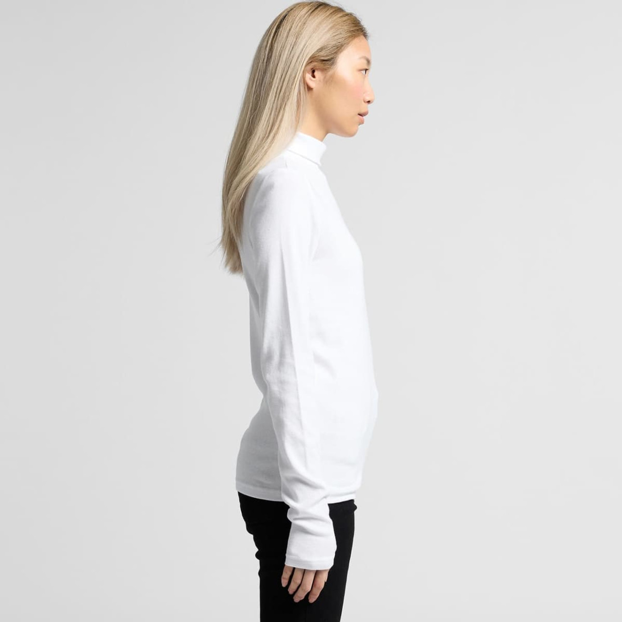 A white turtle neck jumper with long sleeves, shown on a person in profile against a plain background.