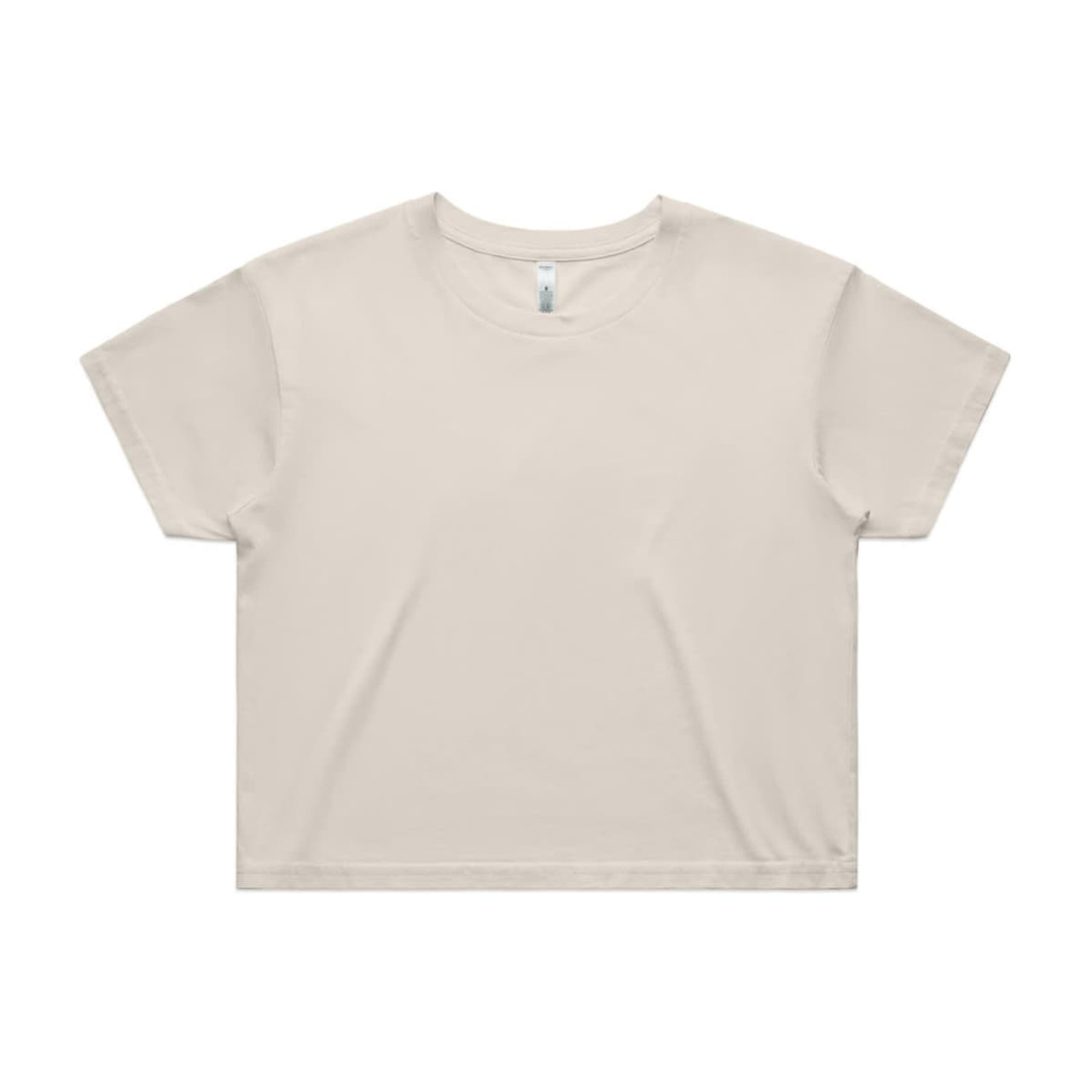A light beige crop tee with a relaxed fit, featuring a simple design and a logo on the label.