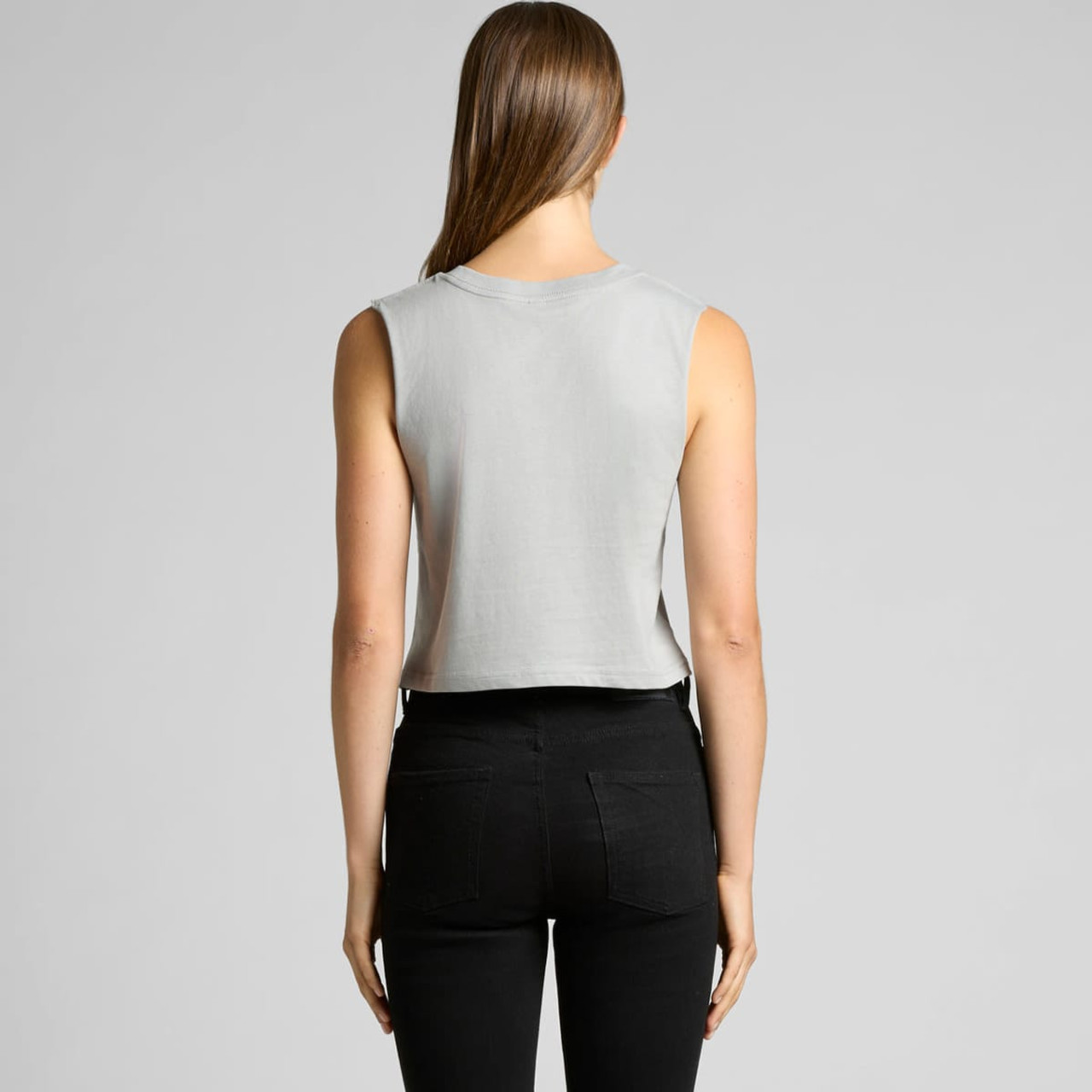 A cropped tank top in a light grey colour, featuring a round neckline and sleeveless design. It has a logo.