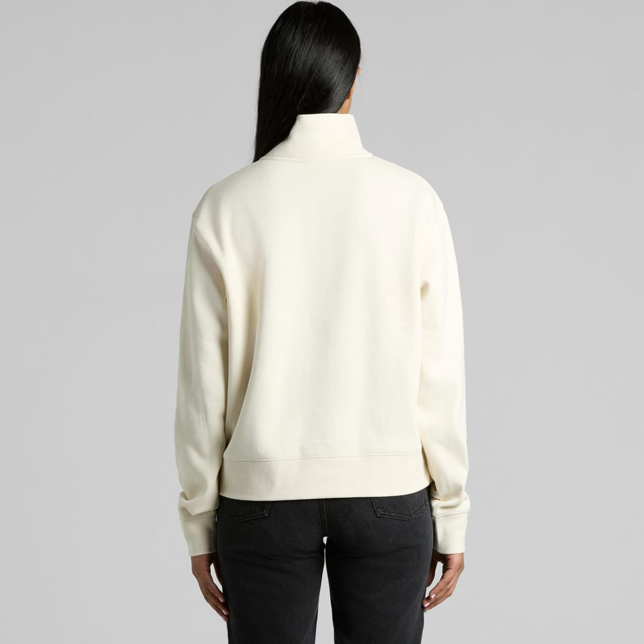 A cream-coloured half zip crew jumper with a relaxed fit, featuring a sleek design and a branding logo.
