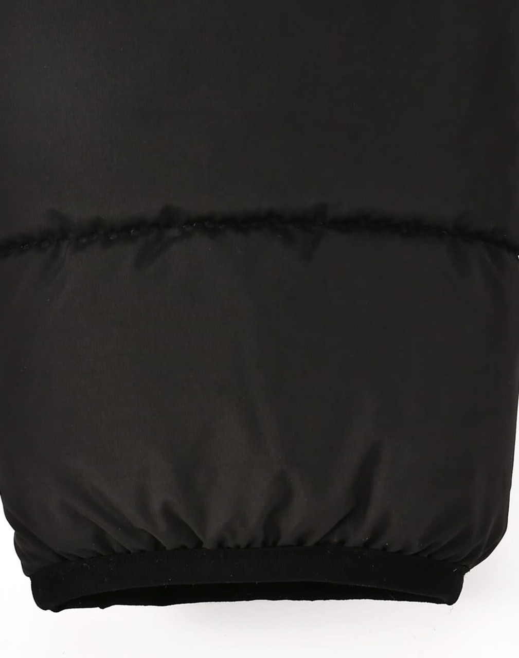 A black men's sustainable insulated puffer jacket featuring a 3D cut with a soft cuff at the hem.