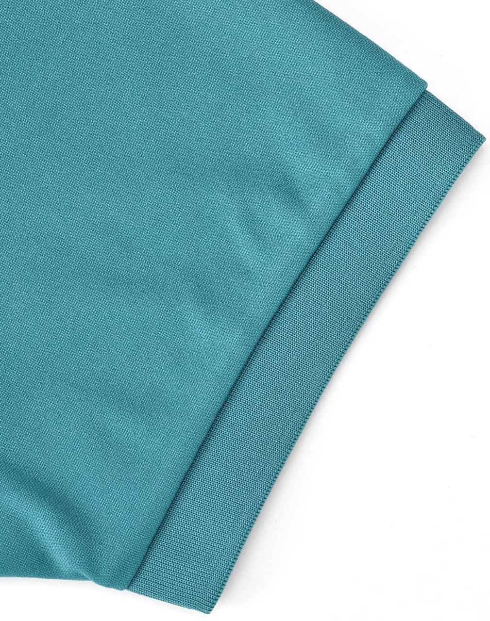 A close-up of a teal polo shirt, highlighting the folded sleeve. The fabric has a smooth texture and includes a logo.