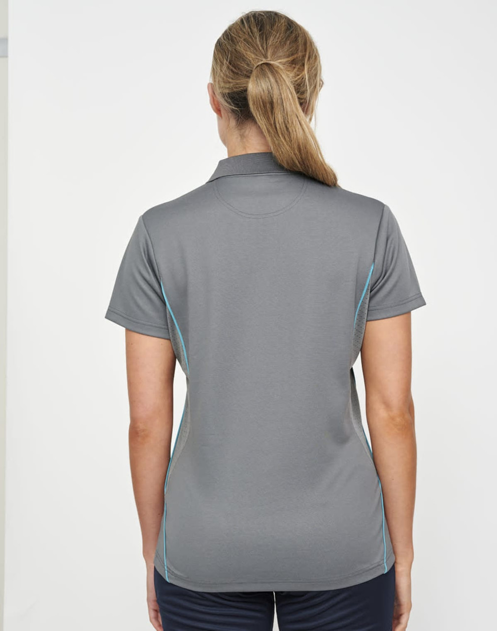 A grey women's polo shirt with blue contrast detailing and a collar, featuring a logo on the back.