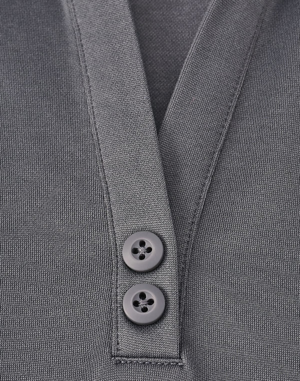 A grey sustainable poly/cotton polo shirt featuring a placket and two buttons. The shirt includes a logo.