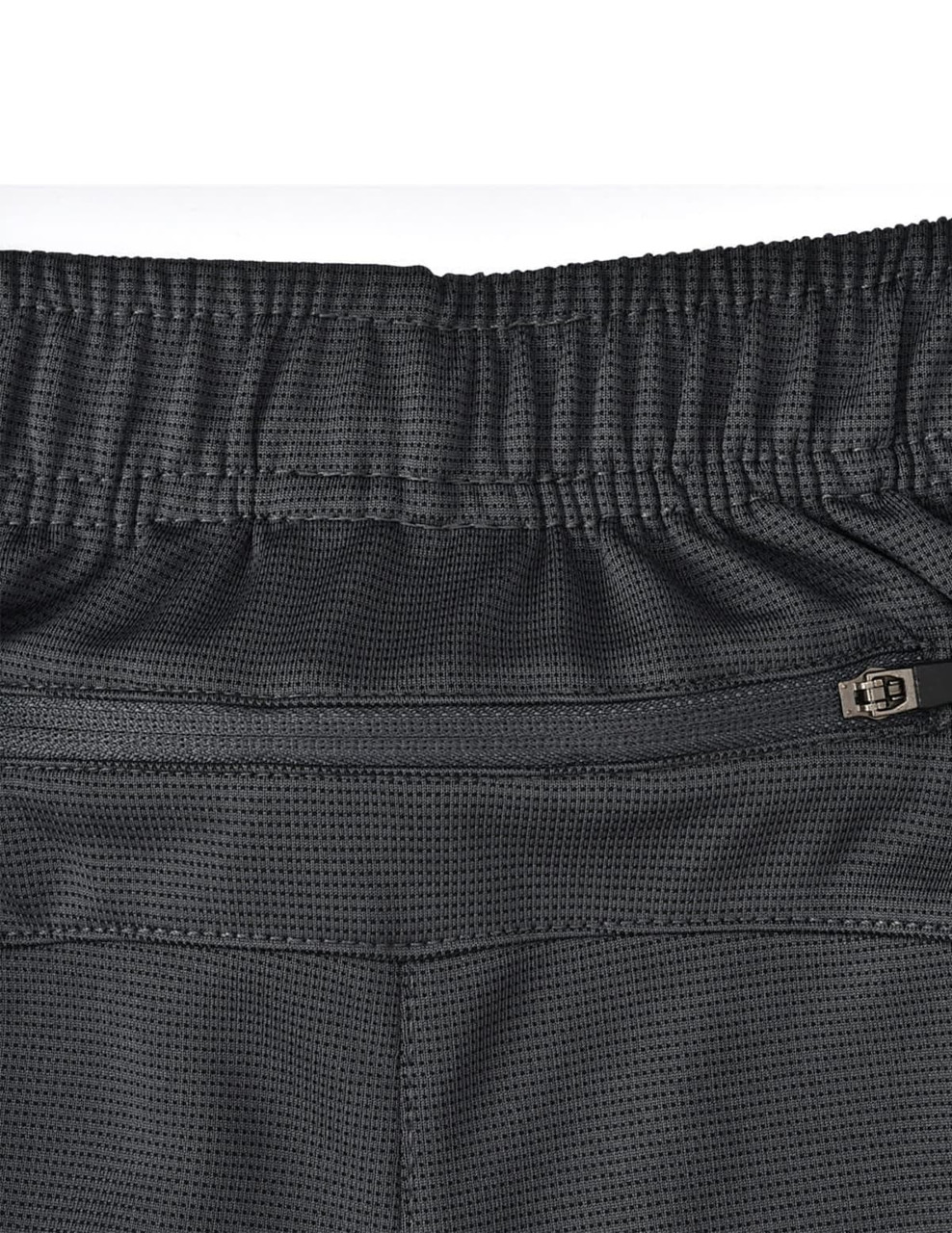 Bamboo charcoal sports shorts in black with a textured fabric and an elastic waistband featuring a zippered pocket.