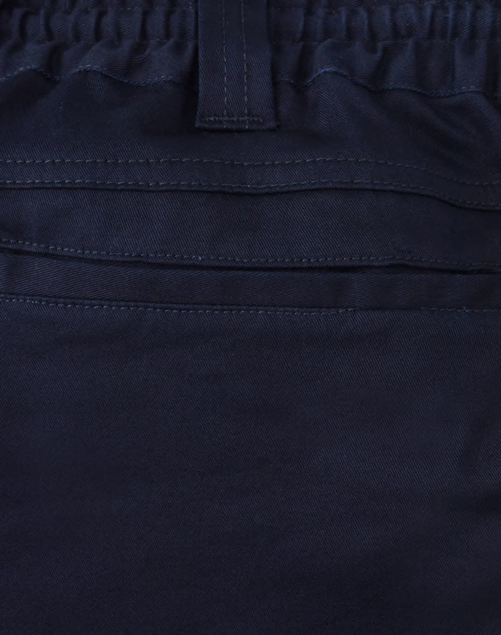 A close-up of navy unisex cotton stretch drill work shorts, featuring an elastic waistband and stitching details.
