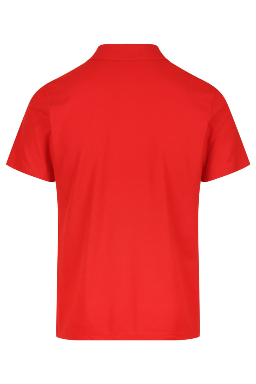 A red polo shirt with a collar and short sleeves, featuring a branding logo on the back.