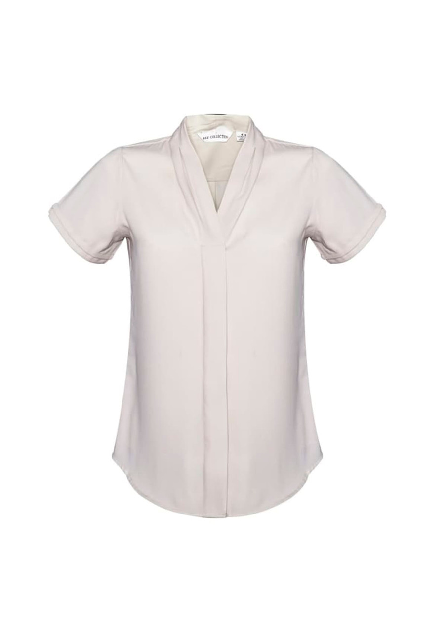 A short-sleeve women's button-up shirt in a light cream colour, featuring a v-neck design and rolled sleeves.