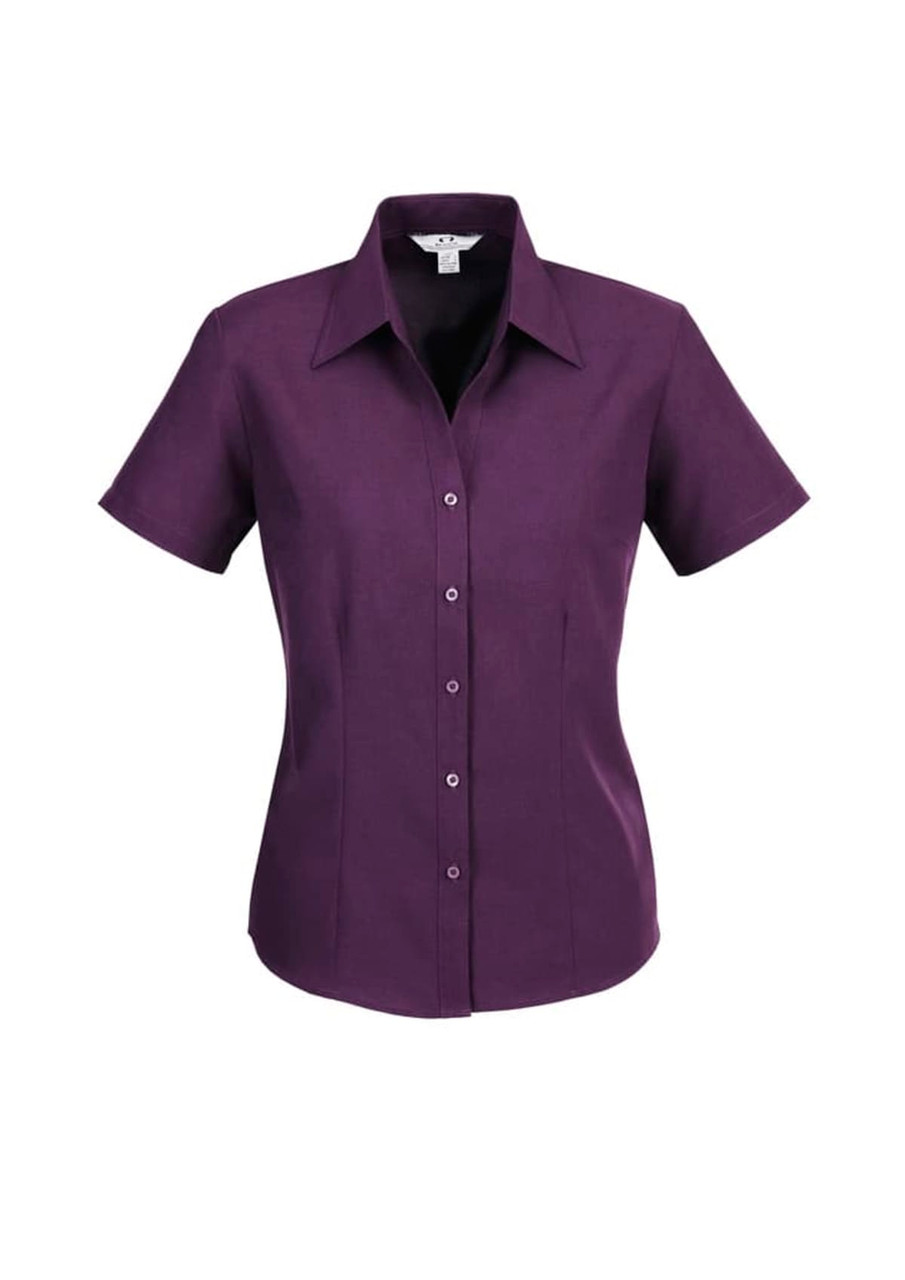 A purple short sleeve button-up shirt with a collared neckline and a fitted style, featuring a logo.