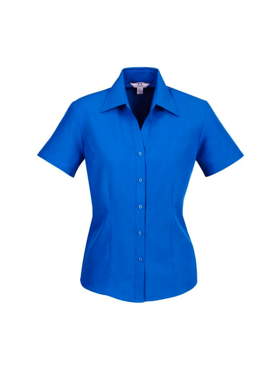 A blue short sleeve button-up shirt with a collar and a logo. The shirt features a tailored fit.