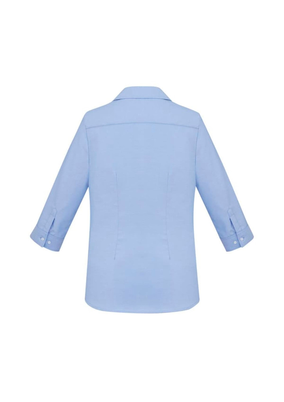 A light blue women's button-up shirt featuring 3/4 sleeves and a collared neckline, with a logo visible.