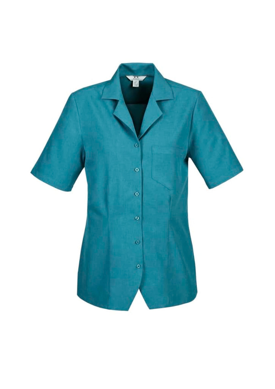 A turquoise ladies plain overblouse with short sleeves and a single chest pocket, featuring a button-up front and collar.