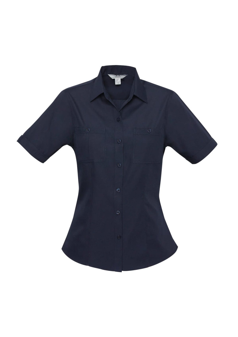 A navy blue women's button-up shirt with short sleeves and two front pockets. It features a logo on the label.