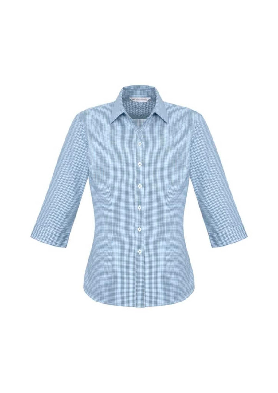 A women's 3/4 sleeve button-up shirt in a light blue check pattern, featuring a classic collar and a logo.