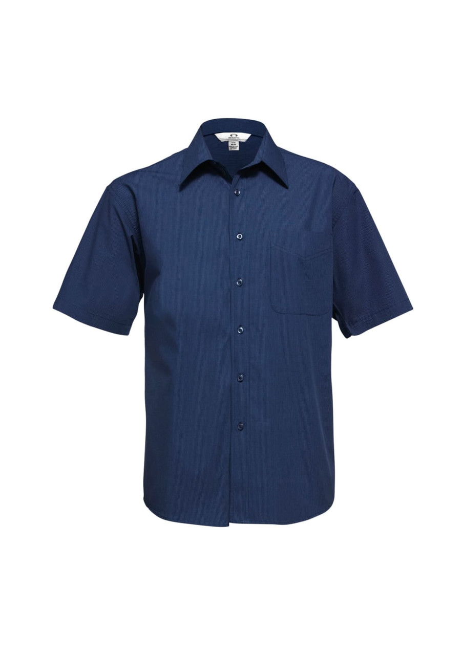A navy short sleeve button-up shirt with a front pocket and a logo on the collar.