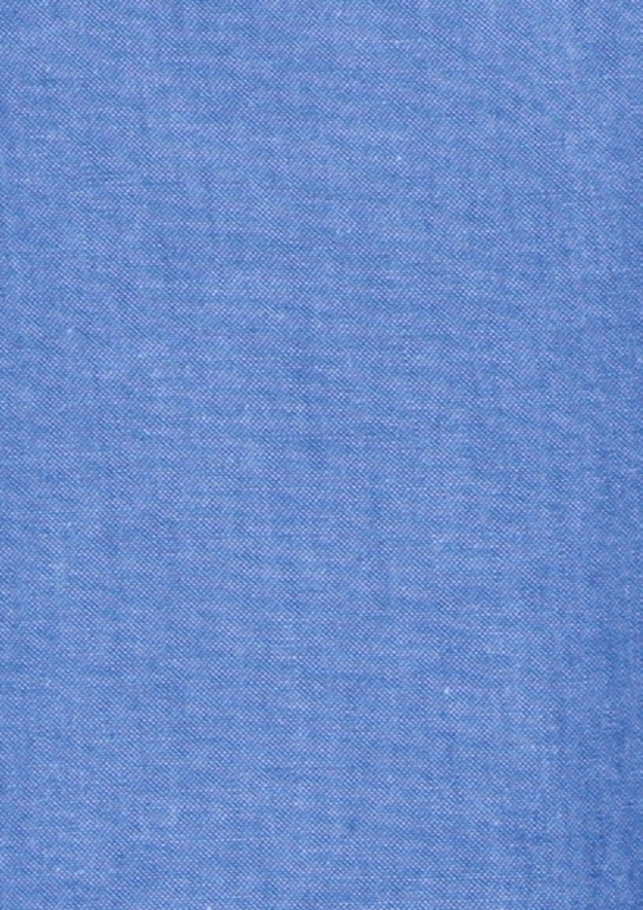 A chambray fabric in a light blue colour, featuring a smooth texture and consistent weave.