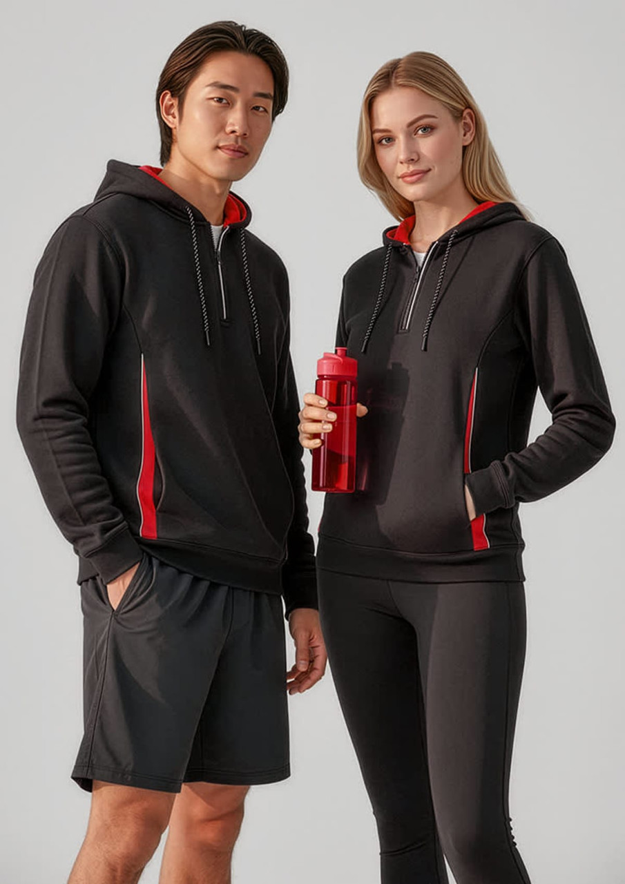 A unisex black hoodie with red accents, featuring a logo, worn by a male and female model.