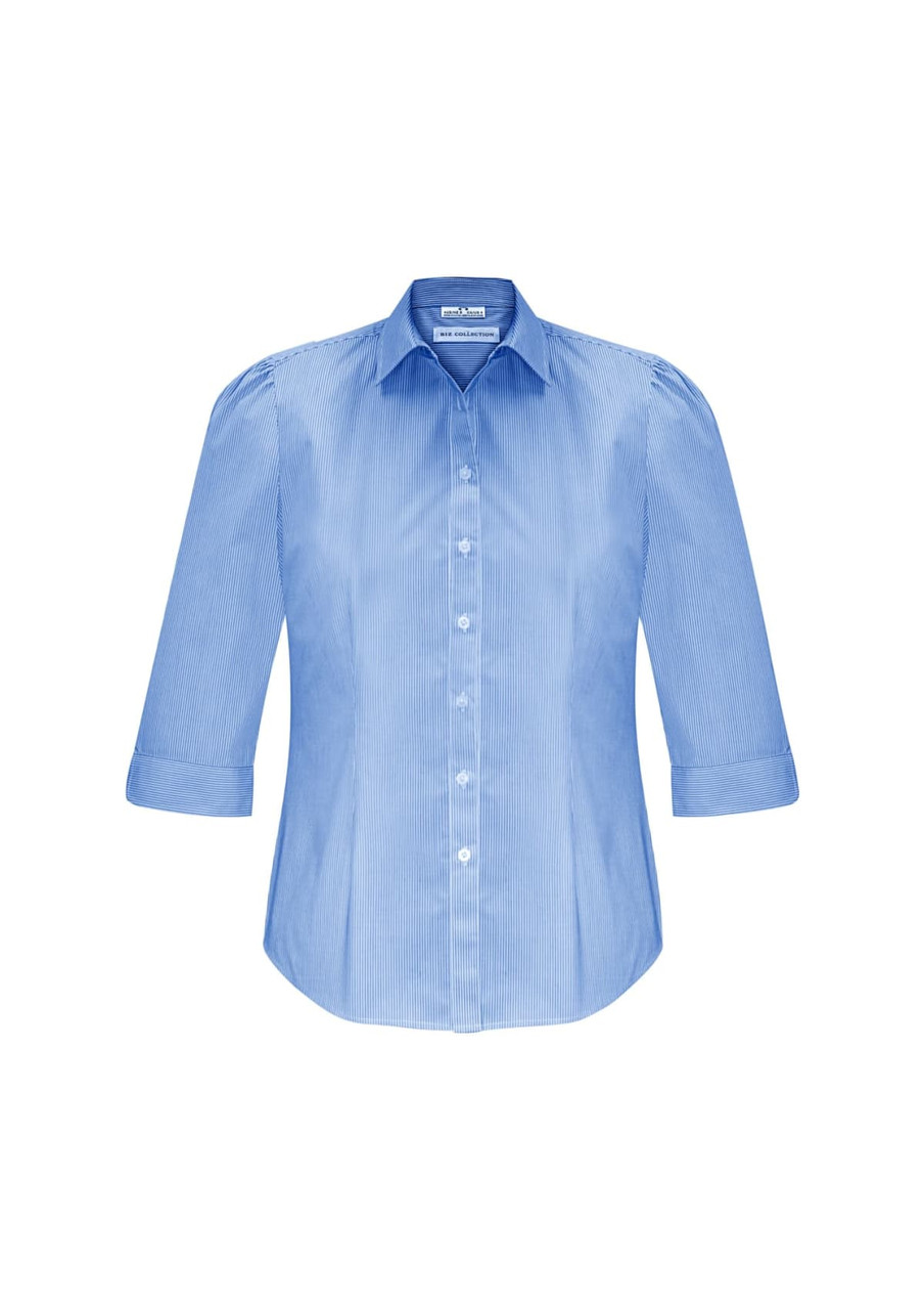 A women's button-up shirt in light blue with 3/4 sleeves and a fitted design, featuring a logo on the label.