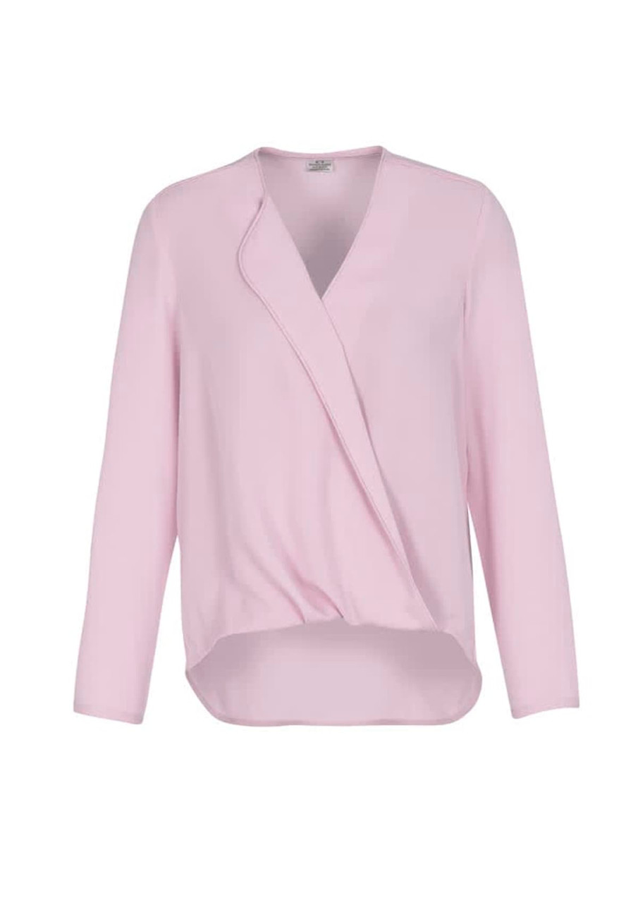 A light pink women's blouse with a hi-lo hem and long sleeves, featuring a wrap design and a logo.