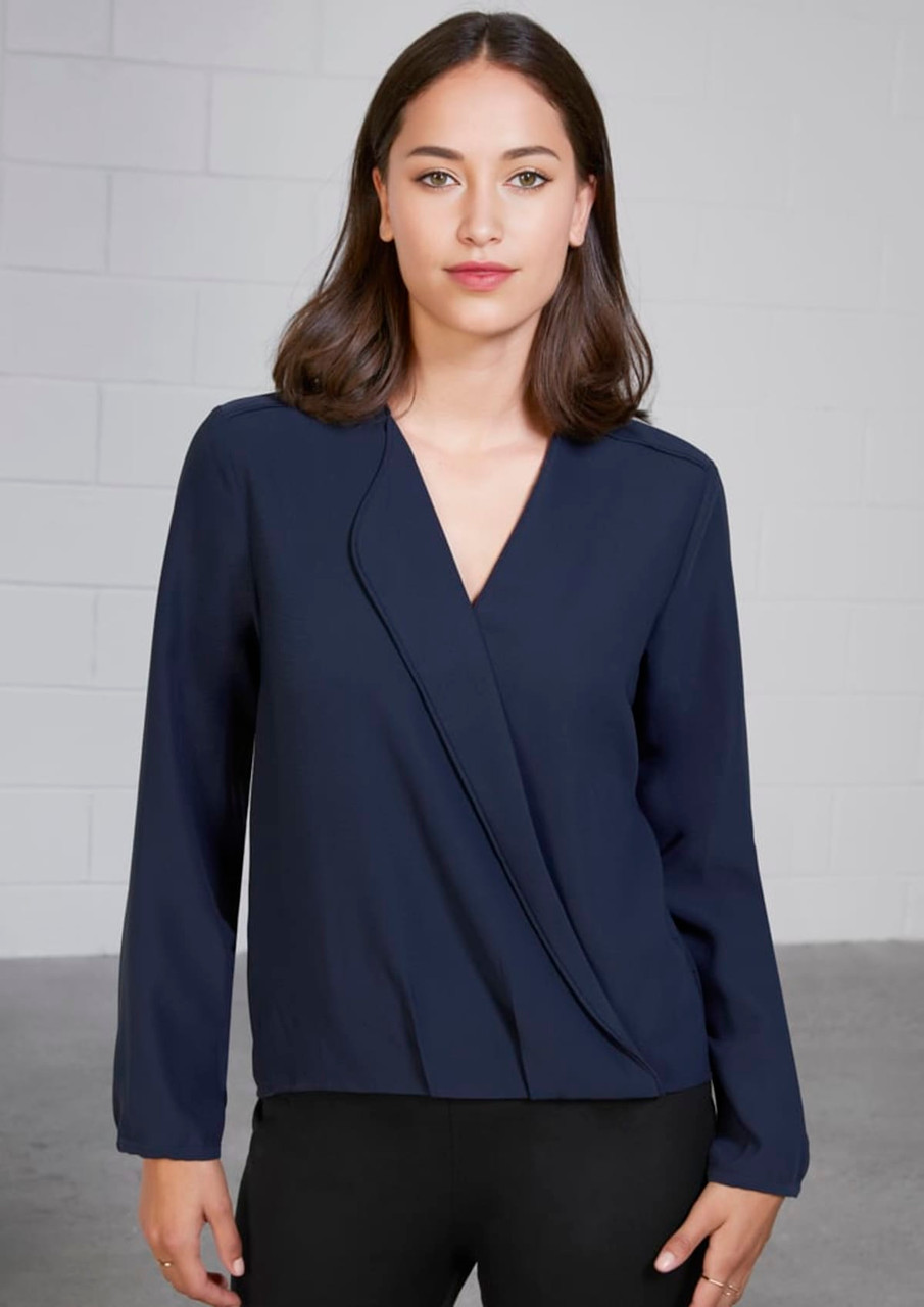 A navy blue women's button-up blouse with long sleeves and a hi-lo hem design. Features a sleek, wrap-like front.