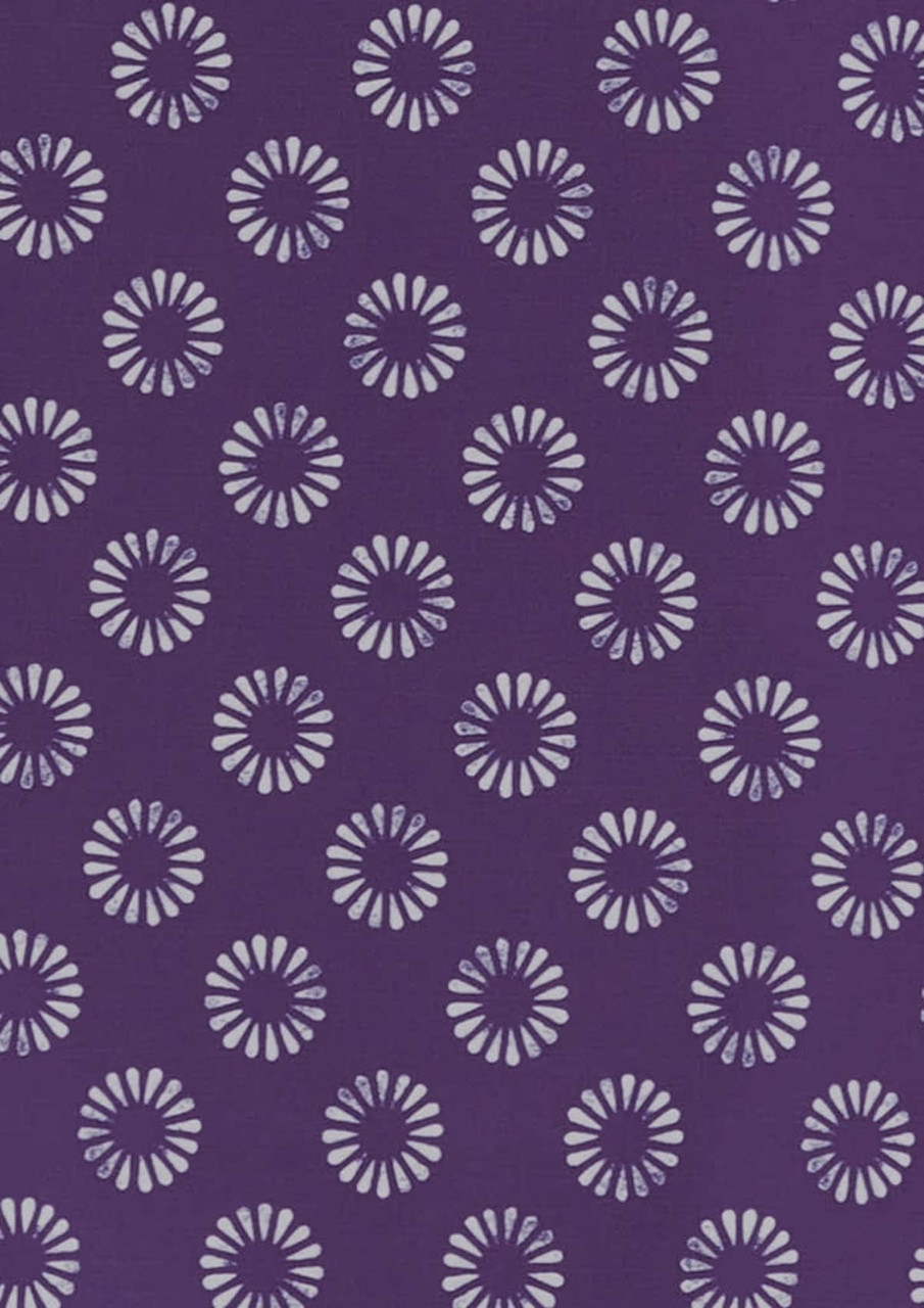 A purple tunic featuring a daisy print pattern in lighter shades. The design includes multiple floral motifs.