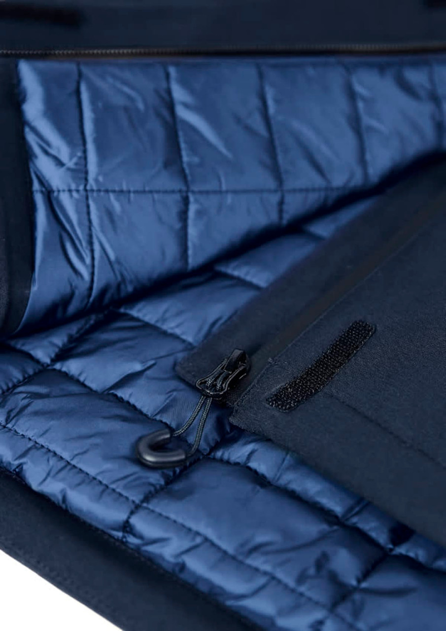 A navy blue insulated jacket interior features quilted lining and a zippered pocket. Includes a logo on the exterior.